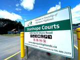 Image shows a sign denoting the Stanhope Courts. 