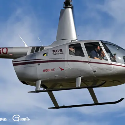 Image shows a helicopter in flight. 