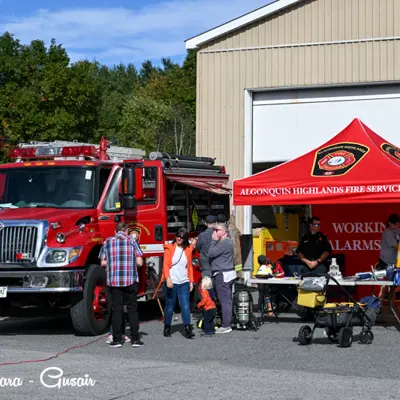 Image shows members of Algonquin Highlands Fire Services at a fly-in. 