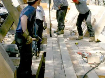 Image shows the installation of the new log chute. 