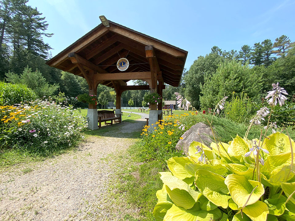 Image shows the timber frame entryway of Dorset Lions Centennial Park.