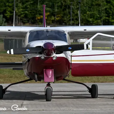 Image shows a man opening the door of a plane.