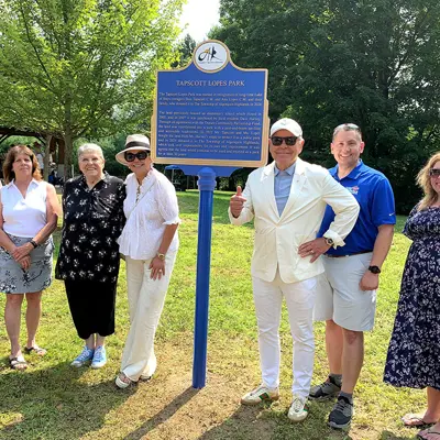 Image shows the unveiling of a sign at Tapscott Lopes Park. 