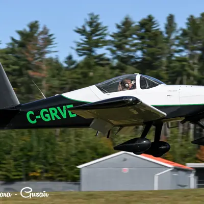 Image shows an airplane taking off.