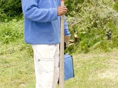 Image shows a man wearing a hard hat. 