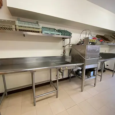 Image shows the dishwasher in the main kitchen at Stanhope hall. 