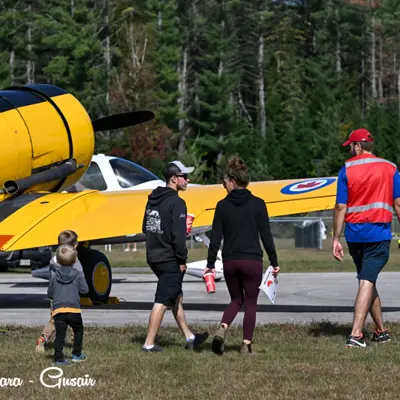 Image shows a family looking at aircraft.