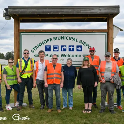 Image shows volunteer and members of the airport committee. 